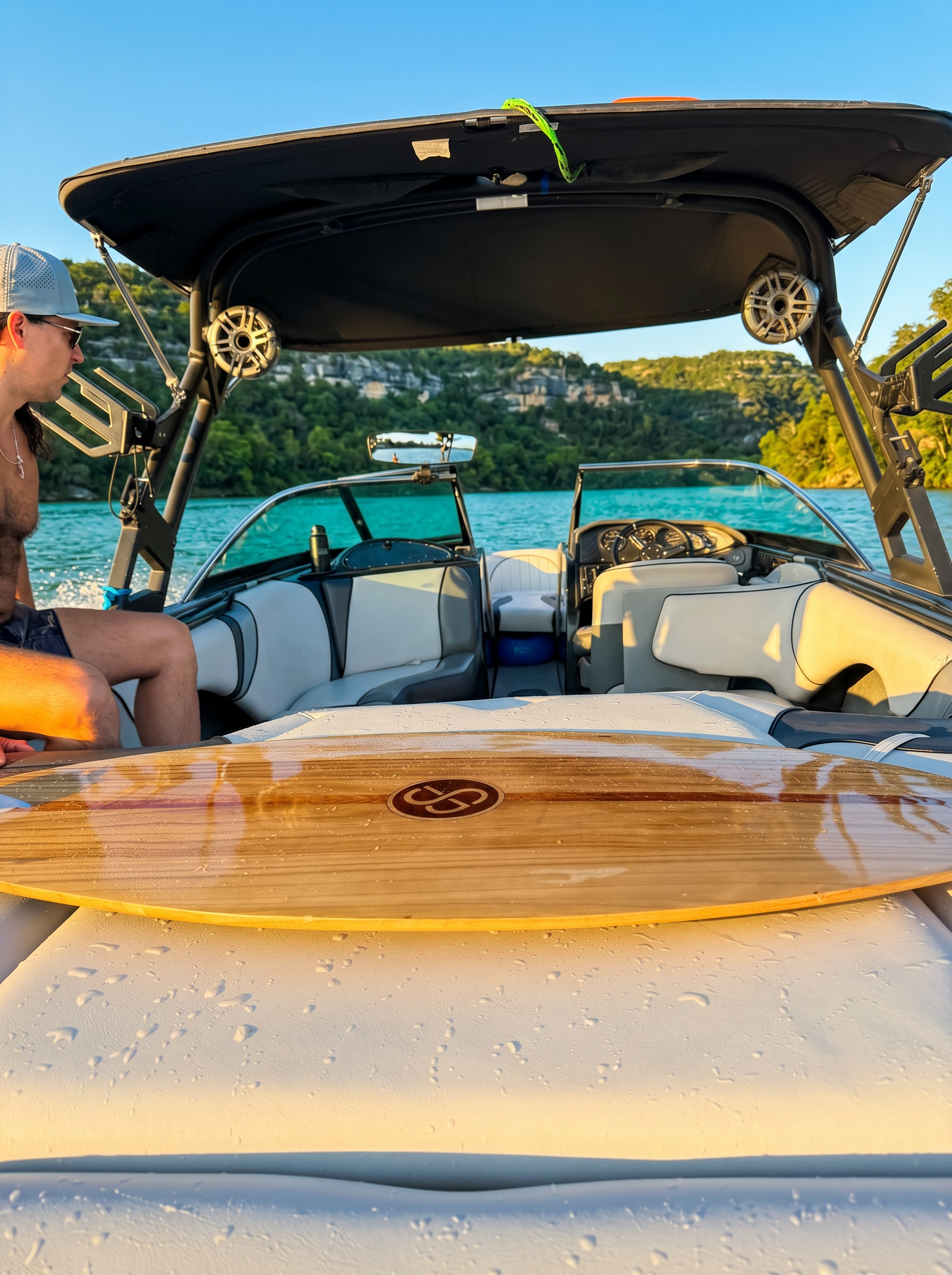 2021 Sanger V237 SX wakesurf boat on Lake Austin at golden hour